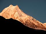 Manaslu 07 03 Manaslu Medium Shot Sunrise From Syala Wow! The subtle changes of the light on Manaslu are terrific. Manaslu (8156m) is said to derive from the Sanskrit word Manasa, which means soul; therefore Manaslu is the Mountain of the Soul. It was earlier known as Kutang I, while the Survey of Indias symbol was merely Peak XXX. According to Snelgrove, the local Tibetan name for Manaslu is Pung-gyen, which is also the name to the god who resides on it.